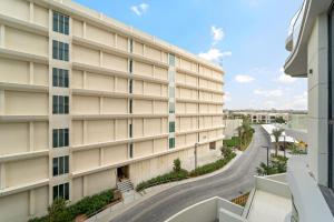 an apartment building with a road in front of it at FIRST CLASS Studio Beach View Living Bliss in Ras al Khaimah