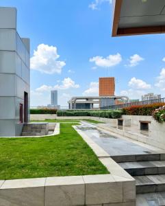 a view of the courtyard of a building at Comfy Plum West Gate Condo 1 BR in Ban Bang Krabu