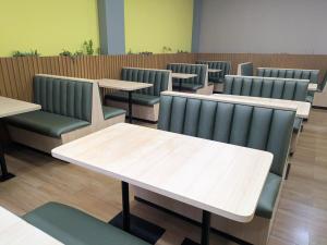 a row of tables and chairs in a restaurant at Bonno Hotel Paulínia in Paulínia +33 photos