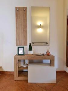 a dressing table in a room with a mirror at Il cantuccio di Federico in Radicofani +31 photos