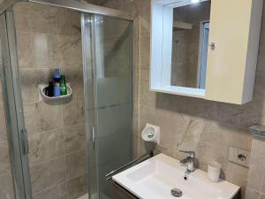 a bathroom with a sink and a shower at MyLago in Baveno +20 photos