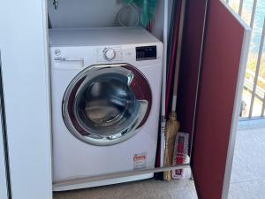a washer and dryer in a small room at MyLago in Baveno