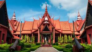 a building with a red roof with turrets at A One Oasis River View Hotel in Phnom Penh