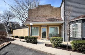 a house with a front door with a porch at Haven at Hazel~Downtown Bungalow in Demorest