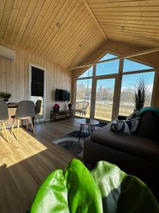 a living room with a couch and a table at Osada Rycerska & Apartamenty Rycerskie in Inowłódz