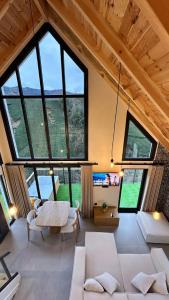 a large living room with a large group of windows at Çavdi Villa in Ardeşen