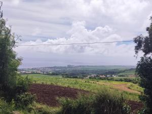 a view of the countryside from a hill with a telephone wire at Maison agréable, emplacement idéal in Sainte-Suzanne
