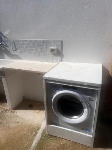 a washer and dryer sitting on a table at villa ingrassia in Favignana