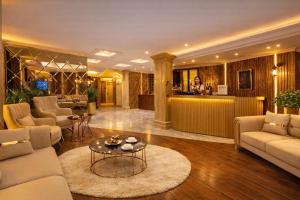a living room with couches and a table at Ayasofya Hotel - Special Class in Istanbul