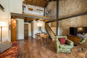 a living room with a couch and a table at Borgotufi Albergo Diffuso in Castel del Giudice