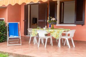 a table and chairs sitting on a patio at Residence Villa Franca in Capoliveri