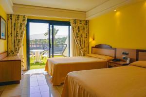 Krevet ili kreveti u jedinici u okviru objekta SBH Crystal Beach Hotel & Suites - Adults Only