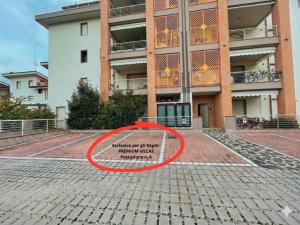 a sign on the ground in front of a building at PIOPPETO OVEST - Premium Villas in Giulianova