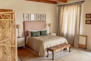 a bedroom with a bed and a window at Firgrove Country Lodge in Robertson