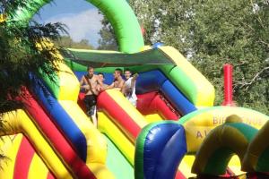 a group of people on a inflatable play structure at ZEcamping 3 étoiles chiens acceptés animations piscine chauffée in Grand-Laviers