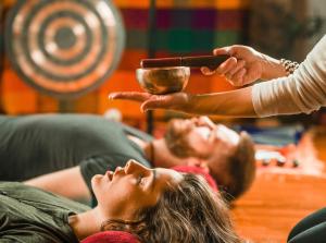 a group of people laying on a couch holding a bowl at Dimora Blu Maldives in Dharavandhoo