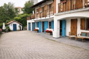 a cobblestone street in front of a building at Appartamento a due passi da Burcina in Favaro +25 photos