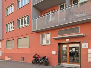 a motorcycle parked in front of a building at Cozy 1BR near lake with balcony - Mill 422 in Zurich