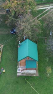 an overhead view of a house with a green roof at Koliba Bajka in Bijelo Polje +1 photo