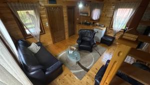 an overhead view of a living room with furniture and a cat at Koliba Bajka in Bijelo Polje