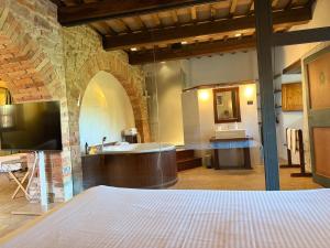 a large bathroom with a tub and a sink at Castello Di Petroia Dimora d'Epoca in Gubbio