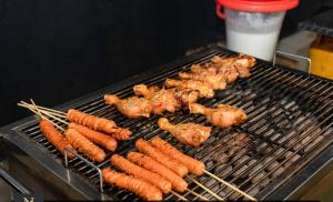 a bunch of chickens and carrots on a grill at Villa Nelith in Galle