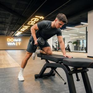 a man exercising on a treadmill in a gym at htop Platja Park - Bliss in Platja d'Aro