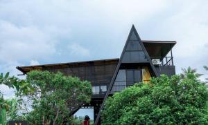 a modern house with a glass facade at Villa Nelith in Galle +10 photos