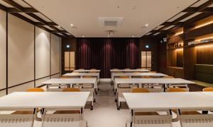an empty dining room with tables and chairs at Mansion Bridge Cheonan in Cheonan