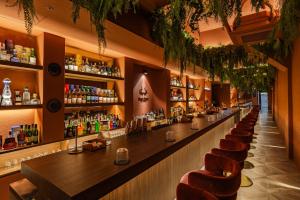 a bar with a row of bar stools at Mansion Bridge Cheonan in Cheonan