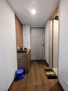 a room with a kitchen with a counter and a door at Home Bliss BnB in Greater Noida +5 photos