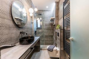 a bathroom with a sink and a mirror at K35 Apartments in Preveza +102 photos