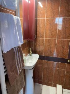a bathroom with a sink and a toilet in it at Serres central house in Serres +4 photos