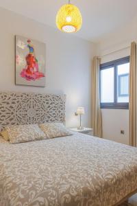 a bedroom with a large bed and a window at Cotillo Jolanda in El Cotillo +38 photos