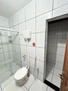 a bathroom with a toilet and a shower at Beach House Suítes Jeri in Jericoacoara +34 photos