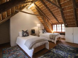 a bedroom with two beds in a attic at Hilton Creek in Hilton