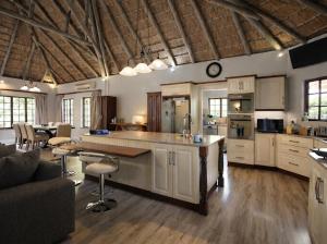 a large kitchen with a large island in a room at Hilton Creek in Hilton