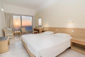 Cama ou camas em um quarto em Hotel Riviera