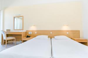 Cama ou camas em um quarto em Hotel Riviera