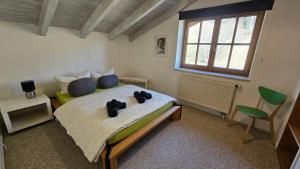 a bedroom with a bed with two teddy bears on it at Jungholz Erlebnis in Jungholz +73 photos
