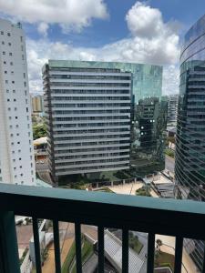 a view of a city from a balcony at Fusion e Vision Flats in Brasília