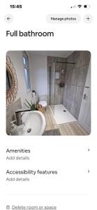 a bathroom with a sink and a shower at Lovely garden cabin in Luton