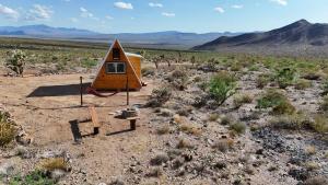 a tiny house in the middle of the desert at Starwalk Modern A-Frame #1 in Meadview