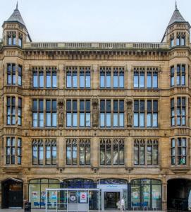 a large brick building with many windows at Urban Luxe Loft Hideaway in Central Station
