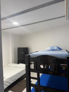 a bedroom with a bunk bed with a blue mattress at Hotel don Nilo in Albania +10 photos