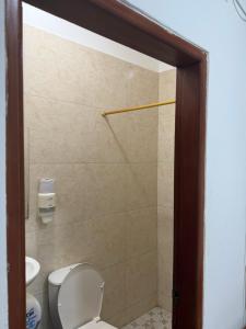a bathroom with a toilet and a shower at Hotel don Nilo in Albania