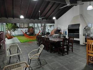 a dining room with a table and chairs at Luxurious Quinta House in Fernando de la Mora