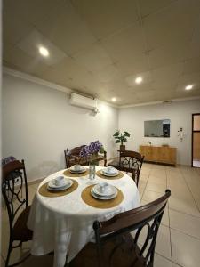 a dining room table with a white table cloth on it at Apartamentos Marconela in San Mateo +149 photos