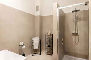 a bathroom with a shower and a sink at City Residence Apartment Hotel in Košice
