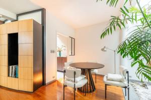 a dining room with a table and chairs at Large fully renovated 250m house in Nantes